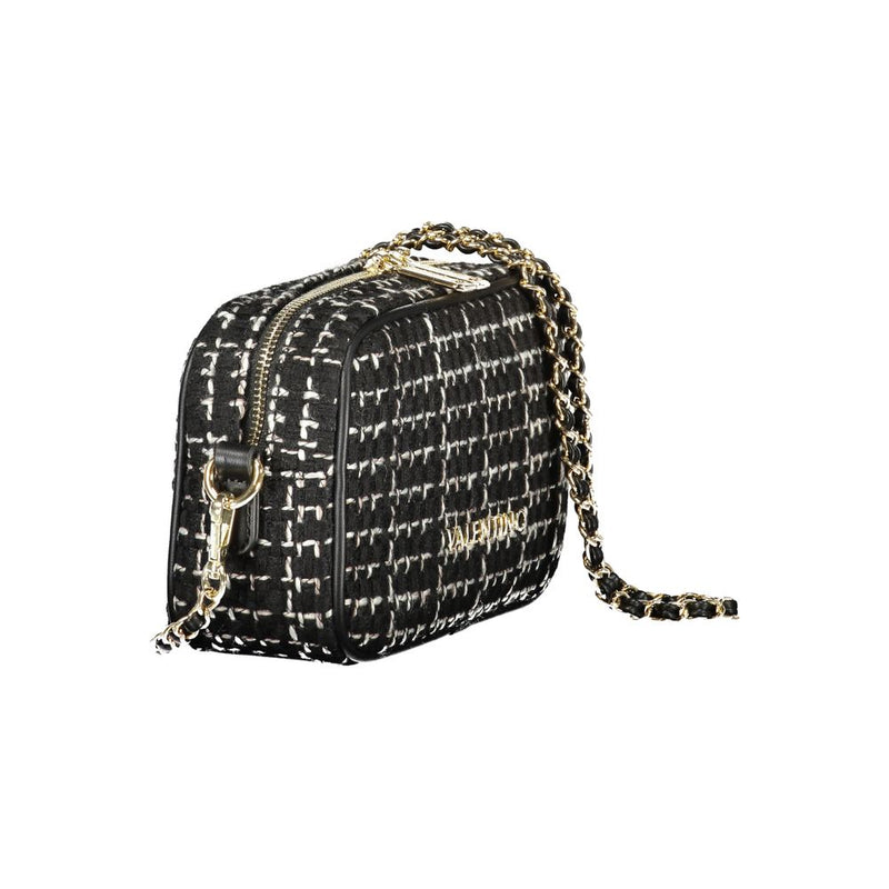 Black and white tweed crossbody bag with gold chain strap and zipper closure