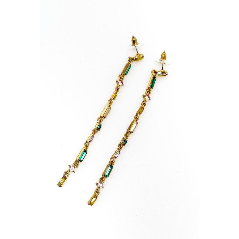Long gold drop earrings featuring multi-colored glass stones in a dangle style
