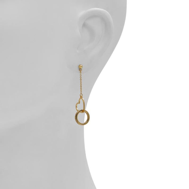 Gold-tone metal drop earrings featuring a chain, heart outline, and small hoop pendant worn on an earlobe
