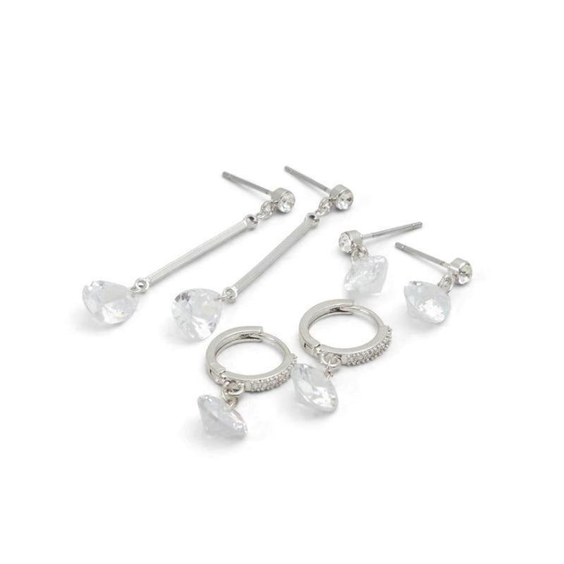 Set of three silver-tone earrings with clear crystal charms including drop, stud, and hoop styles