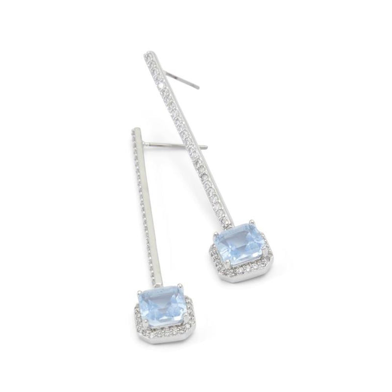 Silver drop earrings featuring light blue square stones and crystal pavé details
