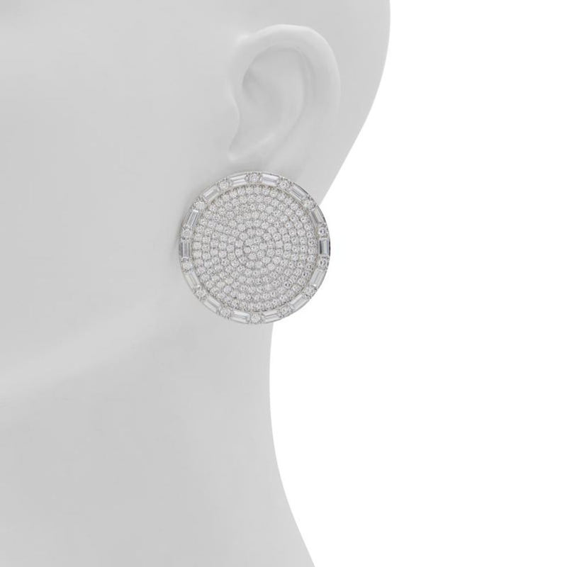 Large silver circular stud earring covered in clear crystals on a mannequin ear