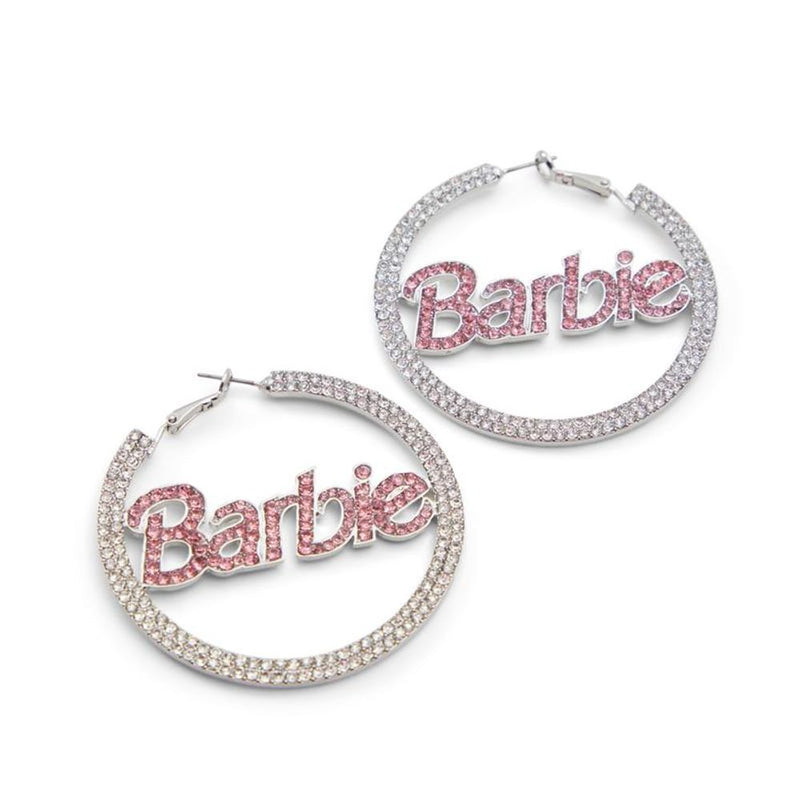 Silver rhinestone hoop earrings featuring the Barbie logo in pink crystals