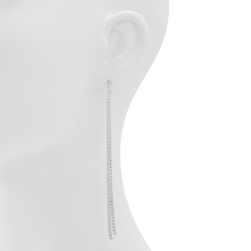 Long, silver, sparkly chain earrings worn on a mannequin ear