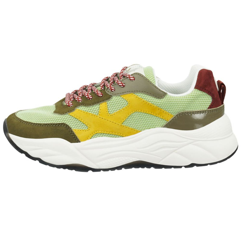 Green goatskin chunky sneaker with yellow and red suede accents, mesh panels, and a thick white sole
