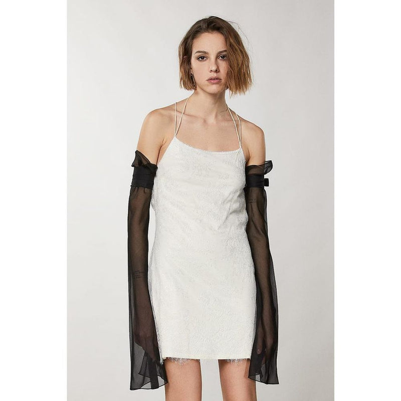 Silver nylon cocktail dress with spaghetti straps and sheer black arm sleeves