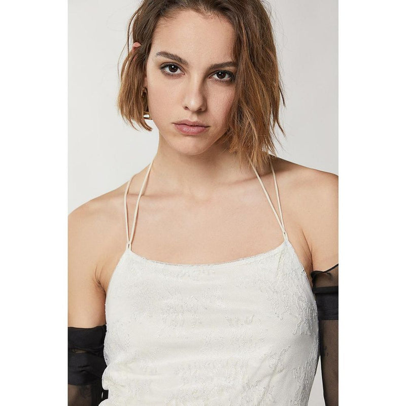 Silver nylon cocktail dress with a spaghetti strap halter neckline and lace overlay
