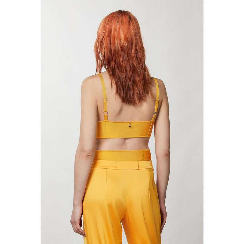 Orange viscose crop tank top with thin straps worn from the back