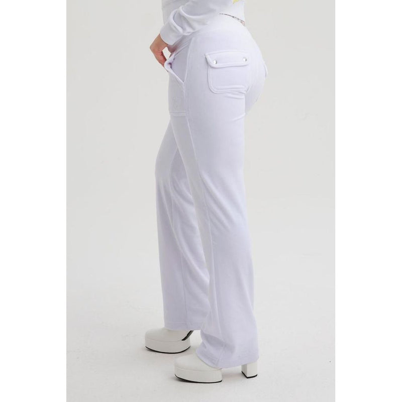 White polyester casual pants with flared legs and back flap pockets worn with platform heels