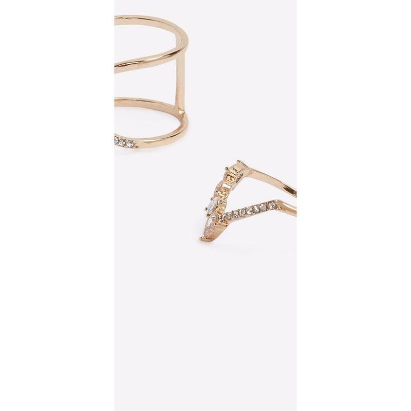 Two gold metal rings with clear crystal embellishments, one multi-band and one v-shaped