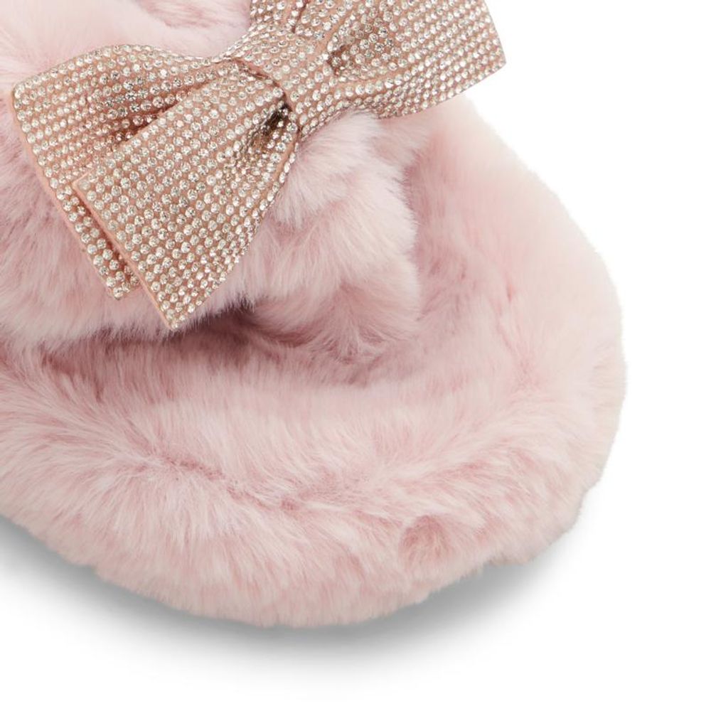 ALDO pink faux-fur slippers featuring a large, rhinestone-encrusted bow on the top strap.