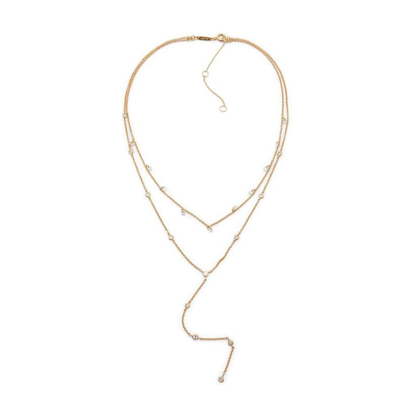 Gold-tone layered lariat necklace with delicate rhinestone accents on a white background