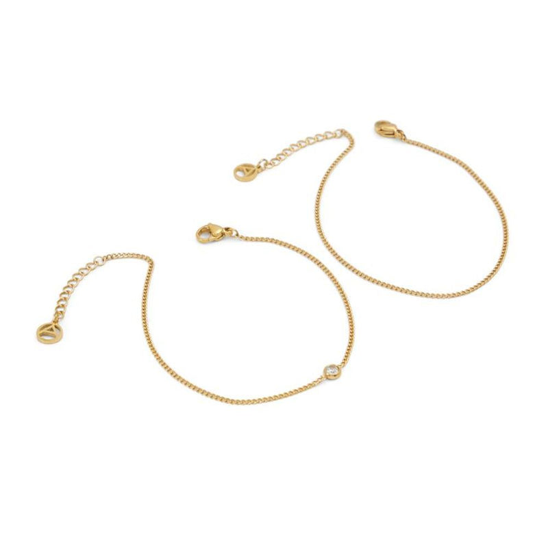 Two gold-colored metal chain bracelets with extension links and lobster clasps