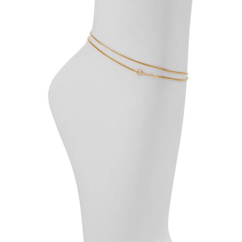 Double strand gold metal anklet with a small sparkling rhinestone accent