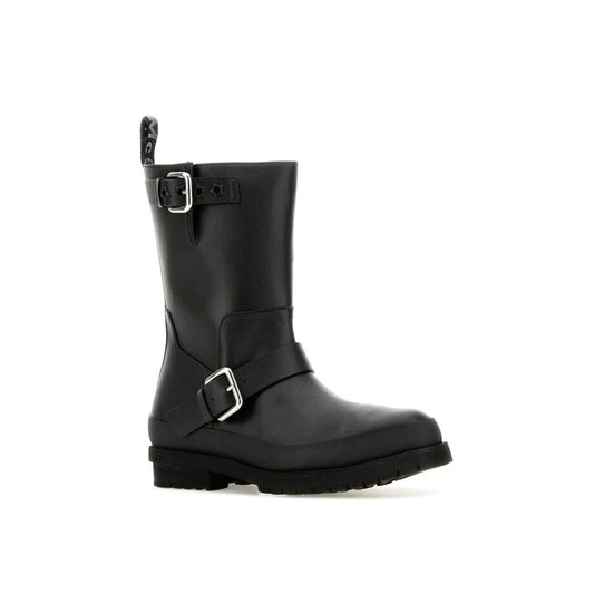 Stella McCartney black polyester mid-calf boots with dual silver buckle straps and a rugged lug sole.