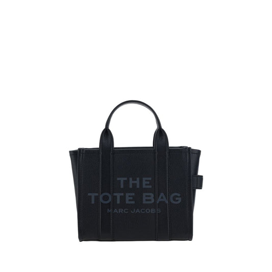 Marc Jacobs black leather handbag featuring "THE TOTE BAG MARC JACOBS" text, dual top handles, and side loops.