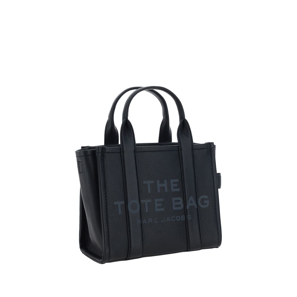 Marc Jacobs black leather tote bag with top handles and tonal branding.