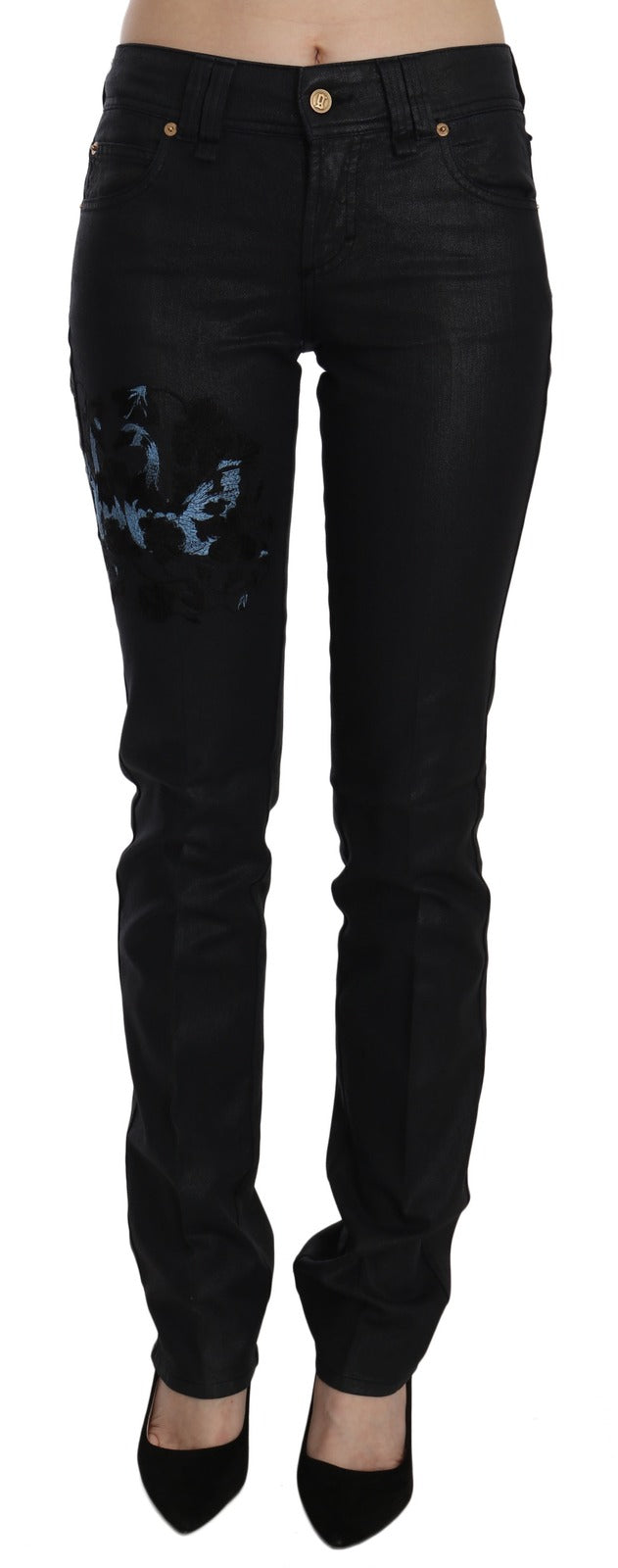 Black mid-waist skinny denim jeans with blue floral embroidery on the right thigh