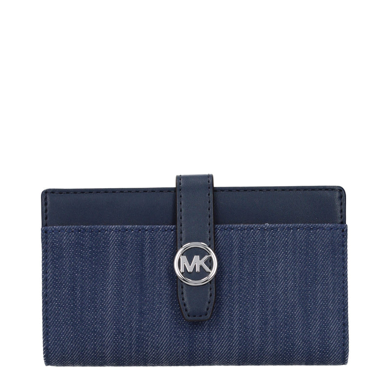 Blue denim fabric bifold wallet with dark blue leather trim and a silver MK logo clasp