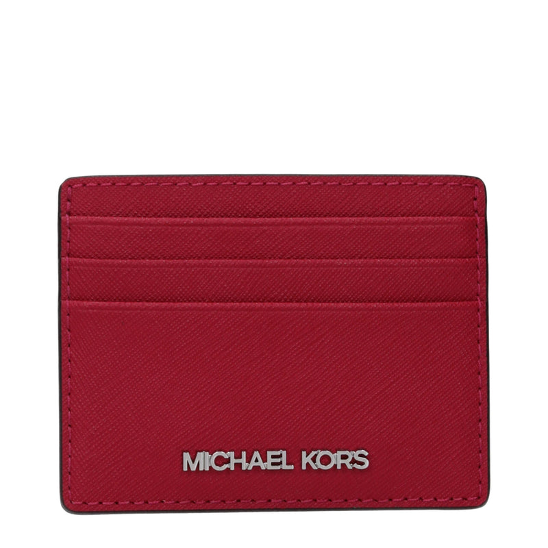 Red leather cardholder with multiple card slots and silver Michael Kors logo