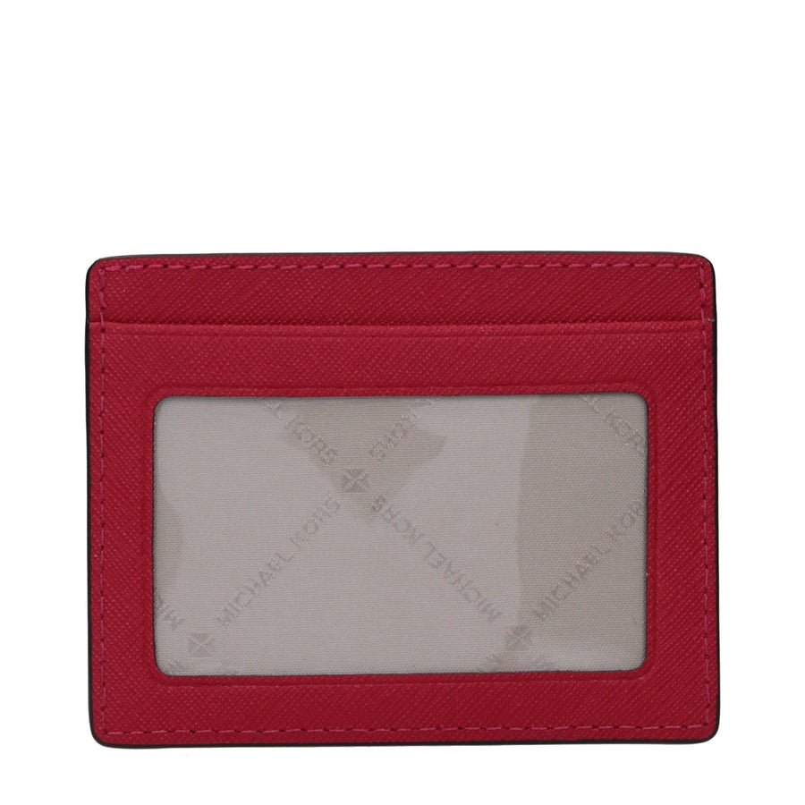 Red leather cardholder with multiple card slots and silver Michael Kors logo