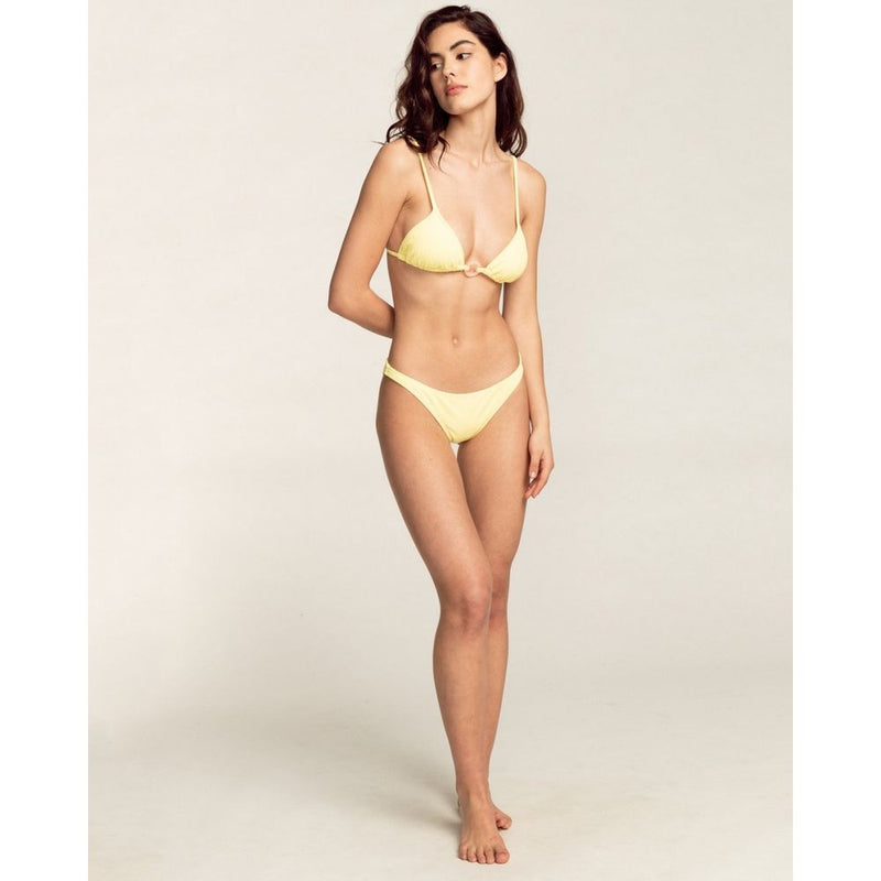 Model wearing yellow bikini with triangle top and low-rise bottoms