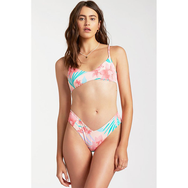 Model wearing pink floral print bikini with scoop top and high-cut bottoms