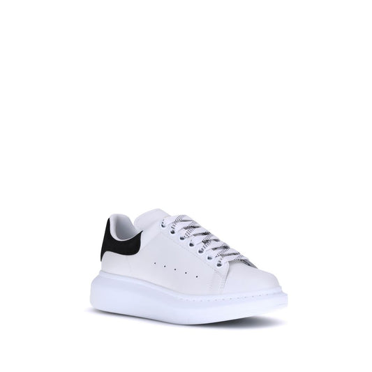 White leather platform sneaker with thick white sole and black heel tab
