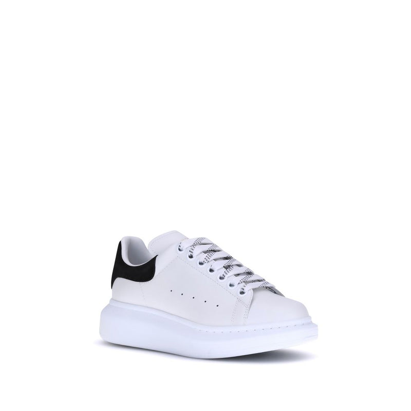 White leather platform sneaker with thick white sole and black heel tab