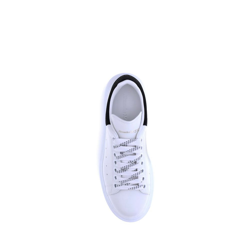 White leather platform sneaker with black heel tab seen from above