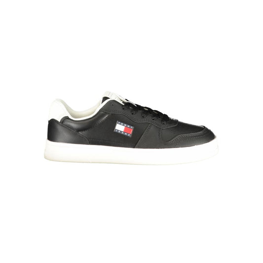 Tommy Hilfiger black polyurethane women's sneaker with lace-up closure, white sole, and iconic logo badge.