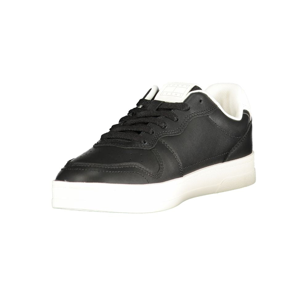 Black polyurethane Tommy Hilfiger women's sneaker, lace-up low-top style with white sole and interior lining.