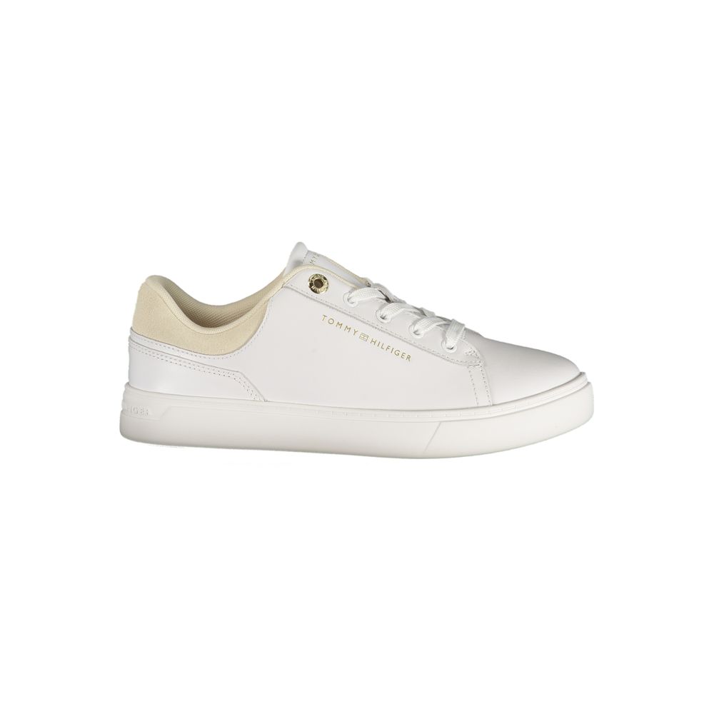 Tommy Hilfiger white polyurethane low-top women's sneaker with lace-up closure and gold logo detail.