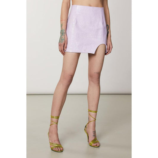 Light purple faux leather mini skirt with a side slit worn with gold strap heels