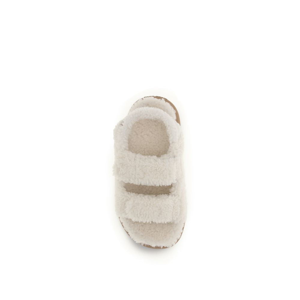 Moon Boot white faux-shearling double-strap slide slippers with a tan footbed.