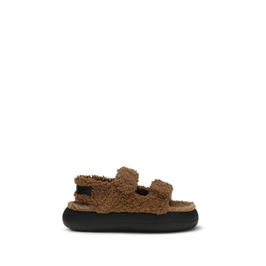 Brown fuzzy polyamide slipper sandals with two adjustable straps and a thick, rounded black rubber sole.
