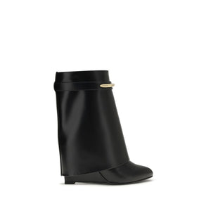 Black Givenchy calf leather ankle boots with a wide folded cuff, almond toe, and gold-tone metal logo hardware.