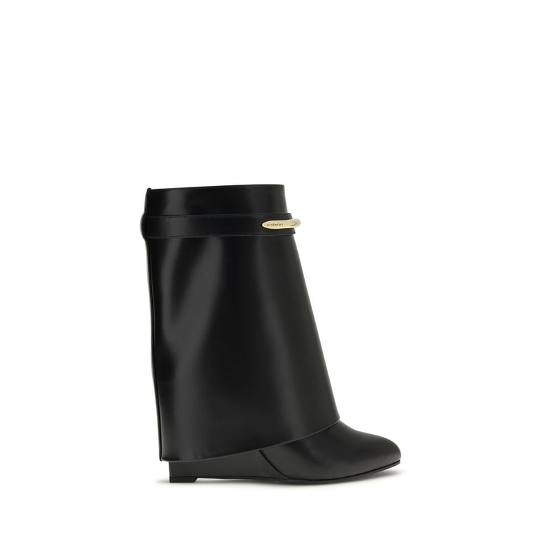 Black Givenchy calf leather ankle boots with a wide folded cuff, almond toe, and gold-tone metal logo hardware.