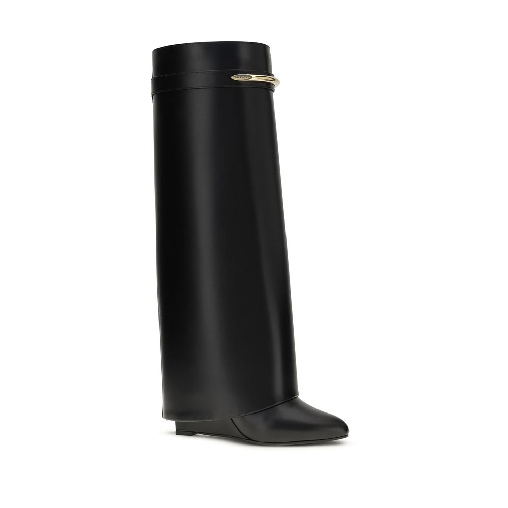 Black Givenchy Shark Lock leather knee-high boot with a wedge heel and gold-tone metal band accent.