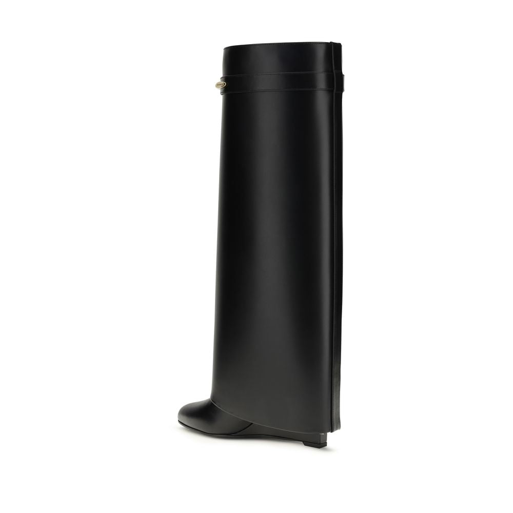 Black knee-high leather boot with a wide shaft, structured silhouette, and a small wedge heel.