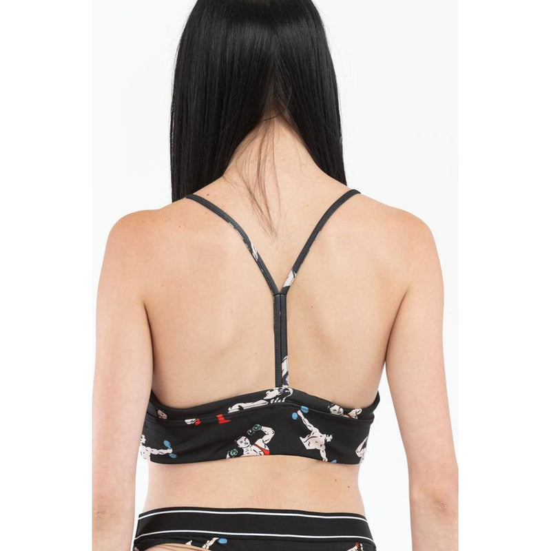 Black polyester tank top with racerback straps and printed graphics worn by a woman