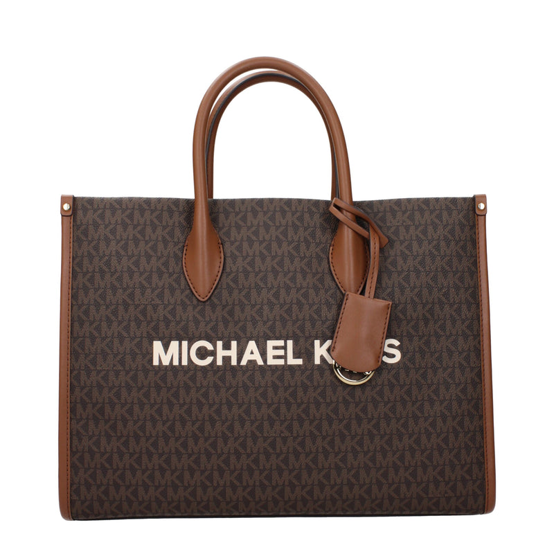 Brown MK monogram canvas tote bag with tan leather handles and a hanging tag