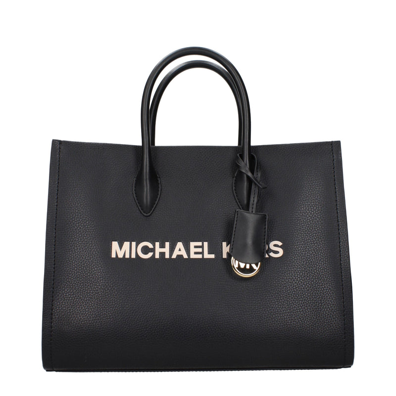 Black leather tote bag with top handles and prominent Michael Kors lettering on the front