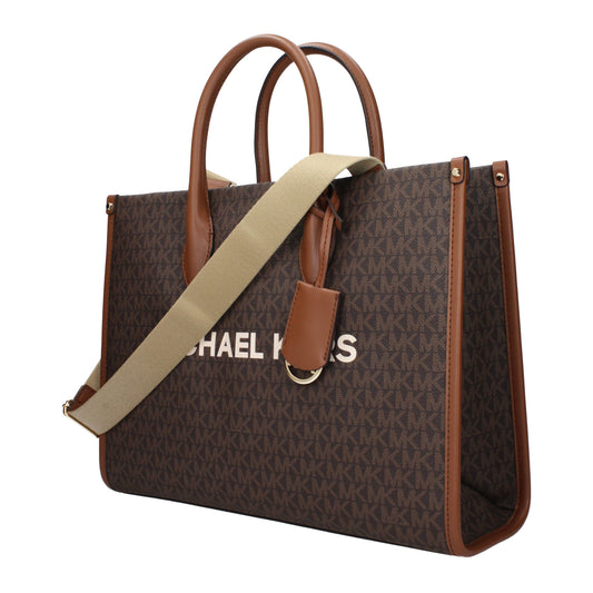 Brown monogram print fabric tote bag with brown leather trim, dual top handles, and a beige shoulder strap