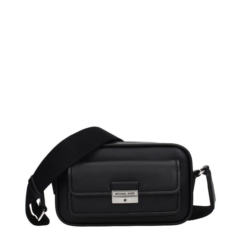 Black leather crossbody bag with a wide strap and front pocket