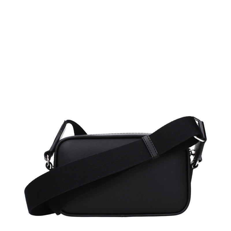 Black leather crossbody bag with a wide fabric strap