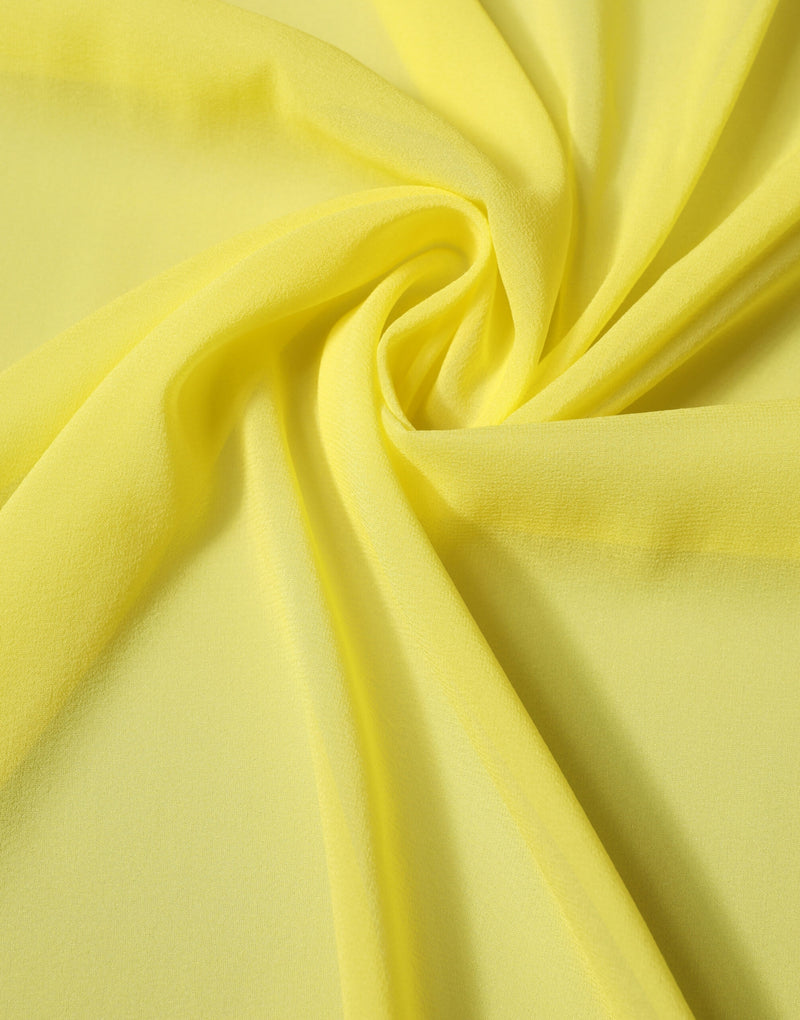 Bright yellow silk scarf or wrap draped with soft folds