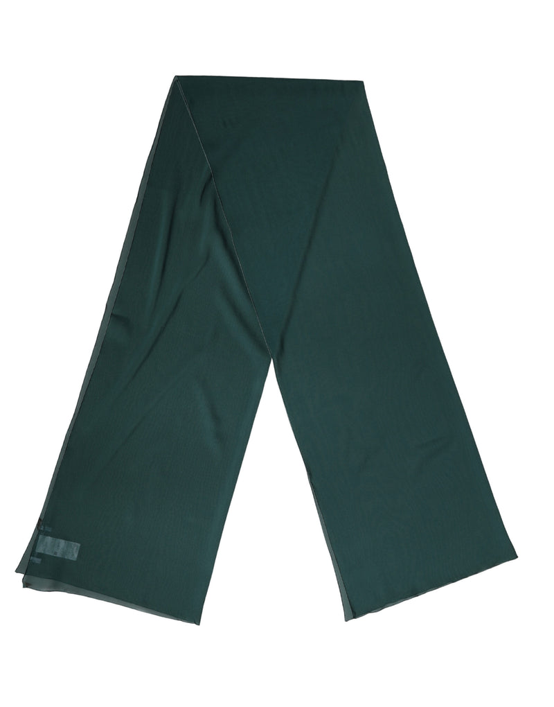 Dark green silk scarf shawl draped against a white background