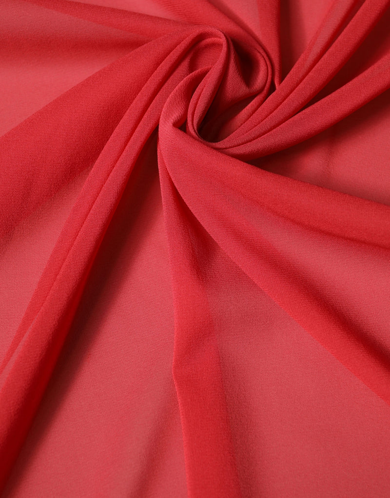 Red silk scarf draped in soft folds