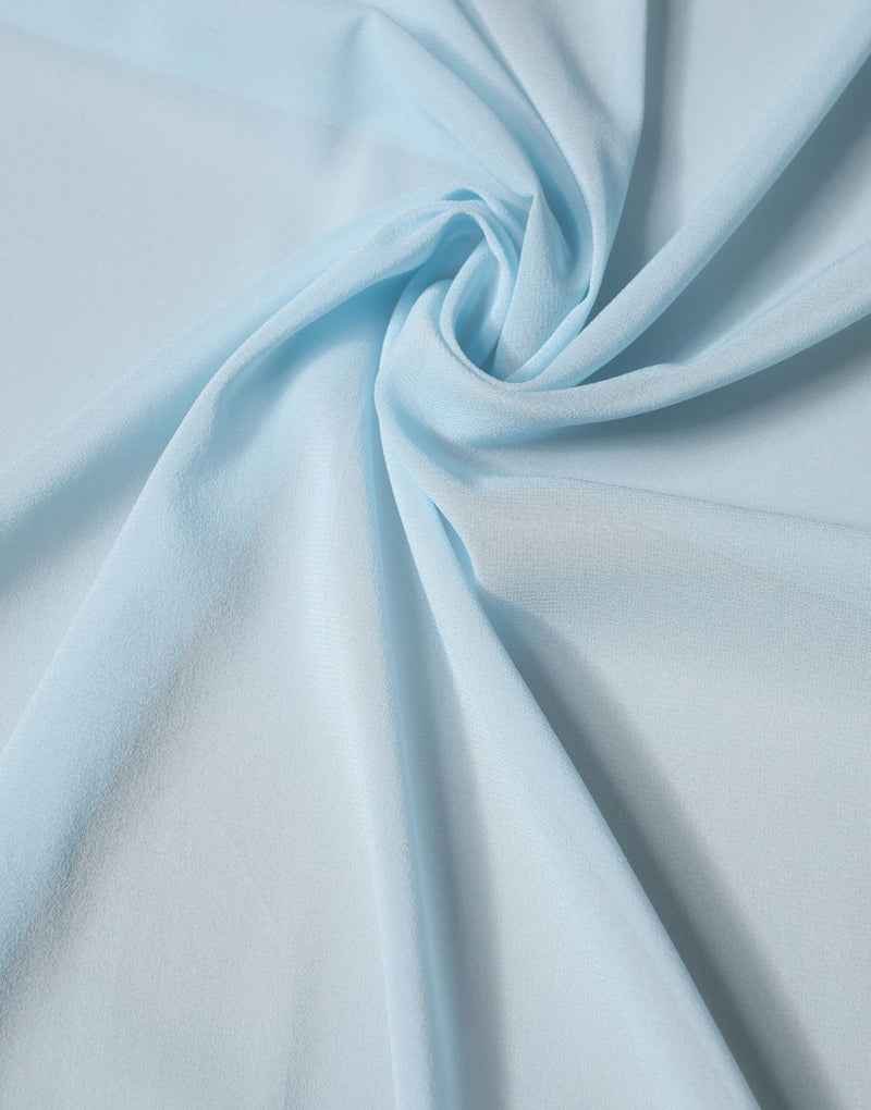 Light blue silk scarf draped softly with a flowing texture